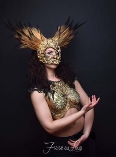 Coiffe ... Reine des EnfersHeaddress "Fraise au Loup Studio"Mask Valkyrie feather headgear. Gold / Black Gradient PaintDecoration gold patina. Baroque moldings made by the AtelierUnique creation of the workshop. Crafted, carved and hand paintedUnique CreationAdjustable elastic link for holdingIdeal accessory for a stage - Cabaret - Burlesque - Drag queen ... or photo shootsFacebook page - https://www.facebook.com/fraiseauloupcostumes Cabaret Burlesque, Cabaret Costume, Burlesque Costume, Costume Masks, Costume Mask, Armor Concept, Fantasy Clothing, Headdress, Fancy Dress