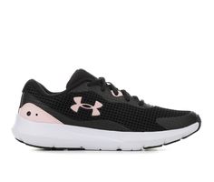 a black and pink shoe with white soles