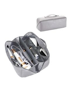 an open travel bag filled with cosmetics and hair brushes on top of a white background