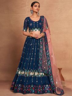 Introducing our stunning "attractive blue embroidered georgette function wear lehenga choli", a must-have for any special occasion. This exquisite ensemble features a blue georgette lehenga with intricate sequin work and embroidered detailing, a matching georgette choli with embroidery and sequin work, and a net dupatta in a similar color adorned with embroidery work, sequins, and a heavy lace border.
The lehenga is semi-stitched up to 42 inches with a 3.5-meter flair, while the choli material i Blue Georgette Sharara For Reception, Traditional Blue Sequin Choli, Blue Floor-length Georgette Sharara, Floor-length Blue Georgette Sharara, Designer Blue Sequined Sharara, Traditional Blue Sequined Sets, Blue Georgette Sharara With Pallu, Blue Semi-stitched Sequined Choli, Blue Georgette Sharara For Diwali