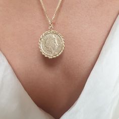 "Beautiful solid gold Queen Elizabeth coin pendant necklace, romantic antique-style jewelry for women in 9k and 14k yellow solid gold. This necklace is made from an old original British coin featuring Queen Elizabeth, which I decorated with twisted wires. It is unique and romantic and will stand out in every outfit you choose. The necklace is available in 9k and 14k solid yellow gold and 16\" or 18\" long. This necklace is simply timeless and breathtaking. You can wear it as a single item or lay Timeless 14k Gold Coin Pendant Necklace, Vintage Tarnish Resistant Medallion Necklace, Timeless Round Coin Pendant Necklace, 14k Yellow Gold Necklace With Coin Pendant, 14k Gold Necklace With Coin Pendant, 14k Gold Necklace With Round Coin Pendant, Vintage Gold Plated Engraved Necklace, Vintage Gold-plated Engraved Necklace, Vintage Engraved Gold Plated Necklace