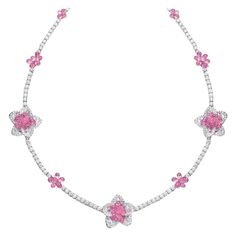 This uniquely stunning necklace is composed of 10.38 carats of round brilliant and rose-cut diamonds, and 37.55 carats of pink sapphires. The briolette cut allows the sapphires to dangle and move, allowing them to capture and reflect light at any angle. This charming necklace is the perfect combination of fun and delicate. Total length 16". Set in 18 karat white gold. Stamped Cellini Appraisal from Cellini Jewelers upon request Pink Diamond Necklace, Briolette Diamond, Diamond Flower Necklace, Sapphire Diamond Necklace, Pink Diamond Jewelry, Expensive Jewelry Luxury, Pink Accessories, Jewelry Luxury, Expensive Jewelry