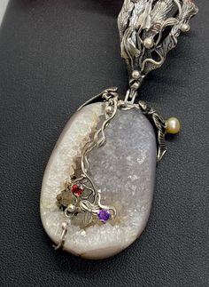 "UNIQUE DRUZY PENDANT Hand-made Sterling Silver , 24 k Gold. Stones used: Druzy, Pearls, Garnet, Amethyst. Height - 78mm, Width - 30mm Unique Handcrafted One-of a-kind Design Pendant Each Piece of Jewelry in my Collection is Absolutely One of a Kind! When you start wearing a piece of my jewelry you will fall in love with it more and more each day and feel that good Energy and Love that I pass into it while creating this piece of Art. A piece of Art created for you to be inspired and love it thro Artisan Multi-stone Necklaces For Gifts, Handmade Luxury Custom Necklace, Luxury Handmade Oval Pendant Necklaces, Handmade Rectangular Pendant Necklace For Formal Occasions, Handmade Formal Necklace With Rectangular Pendant, Formal Handmade Necklace With Rectangular Pendant, Unique Multi-stone Necklace For Gift, Luxury Handmade Jewelry For Art Collection, Handmade Wedding Pendant Necklace