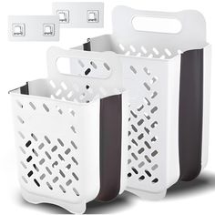 three white and black plastic baskets with handles on each side, one has two holes in the middle