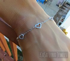 "Cubic Zirconia Heart Dainty SOLID sterling stamped 925 silver Tarnish free Bracelet 7 inch up to 8inch This is a 7\" and goes up to 8\" (Adjustable) - Prong setting, with 80 clear RoundCubic Zirconia bracelet. The thickness of this bracelet is 2mm and the height 7.2 This is SOLID Sterling silver with Rhodium plating which makes this Tarnish free! Please follow care instructions. Any rings with stones, regardless where you purchase, must be removed when washing hands or using hair gels or hair c Silver Dainty Bracelet For Valentine's Day, Dainty Silver Bracelets For Valentine's Day, Dainty Silver Bracelet For Valentine's Day, Dainty Sterling Silver Heart Bracelet As Gift, Dainty Sterling Silver Heart Bracelet For Gift, Dainty Cubic Zirconia Sterling Silver Bracelet For Anniversary, Dainty Silver Heart Bracelet Gift, Dainty Sterling Silver Bracelet For Valentine's Day, Elegant Sterling Silver Heart Bracelet Gift