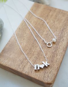 "Personalized letter necklace- Couples Initials Necklace, Tiny letter necklace, Couples necklace, Gift for girlfriend, Valentine's Day Gift, Minimal Necklace, personalized necklace Features: -------------- - rhodium plated charms (hearts and letters) - lowercase block letters - sterling silver chain Personalize this adorable necklace with you and your loved one's initials. Pick the 2 initials from the drop down menu and let me know the length of the chain, up to 19 inches at no additional cost. Initial Necklace For Valentine's Day Anniversary Gift, Initial Pendant Charm Necklace For Anniversary, Mother's Day Gift Initial Necklace With Letter Beads, Valentine's Day Initial Pendant Name Necklace For Anniversary, Anniversary Gift Initial Pendant Charm Necklace, Valentine's Day Anniversary Initial Pendant Name Necklace, Valentine's Day Initial Necklace For Anniversary Gift, Initials Charm Necklace For Anniversary Gift, Anniversary Letter Beads Name Necklace With Initial Pendant