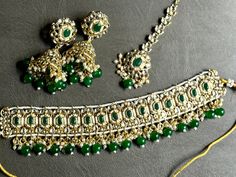 Emerald green choker set Green Kundan Bridal Necklace Bollywood Style, Green Kundan Bollywood Bridal Necklace, Green Bollywood Choker For Wedding, Green Chandbali Bridal Necklace For Eid, Festive Green Bridal Necklace With Stone Work, Bollywood Style Green Kundan Bridal Necklace, Bollywood Style Green Choker For Wedding, Bollywood Bridal Necklace, Green For Diwali, Bollywood Green Bridal Necklace For Diwali