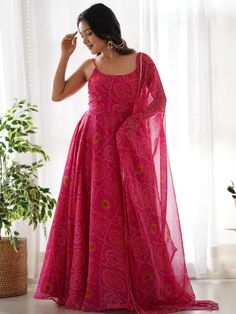 Introducing our stunning "pretty pink bandhani printed chiffon festival wear gown with dupatta" - a must-have for your festive wardrobe! This beautiful pink color gown features intricate bandhani print work, adding a touch of traditional charm. The chiffon fabric adds a touch of elegance, making it perfect for festivals, functions, and special events.
The matching chiffon dupatta with bandhani print work and fancy lace border work completes the look, giving you a coordinated and stylish outfit. अनारकली सूट, Pink Anarkali, Printed Anarkali, Gown With Dupatta, Bandhani Dress, Printed Gowns, Full Length Gowns, Pure Chiffon, Pink Gowns