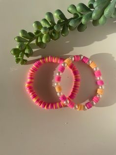 2 gorgeous orange and pink bracelets Pink Bohemian Bracelets For Spring, Coral Round Beaded Bracelets For Beach, Coral Round Beads Bracelets For Beach, Coral Round Beads Bracelet For Beach, Pink Friendship Bracelets For Spring, Orange Bohemian Bracelets For Summer, Bohemian Orange Bracelets For Summer, Orange Bangle Bracelet With Colorful Beads, Adjustable Coral Beaded Bracelets For Summer