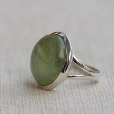 Gemstone - Green Prehnite Gemstone Size -18 mm Round Metal - Sterling Silver Ring size - All sizes available Each Ring made with Precision and love, these rings are perfect for everyday use and a perfect accessory to wear at work. Rings can be customized on request and gemstones can be switched to any other as per requirement. Same design also uploaded with Blue Chalcedony, Hematite, Carnelian, Crystal Quartz, Labradorite, Rainbow Moonstone, Smoky quartz kindly visit my store to view the complet Green Ring With Large Stone, Green Cabochon Round Stone Rings, Silver Peridot Rings With Polished Finish, Green Rings With Large Oval Cabochon Stone, Green Oval Cabochon Ring With Large Stone, Adjustable Peridot Jewelry For Anniversary, Round Peridot Rings For Gifts, Open Ring With Large Stone For Anniversary, Anniversary Rings With Large Stone And Open Ring Design