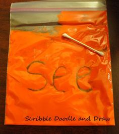 an orange plastic bag with the word sew on it and a pencil sticking out of it