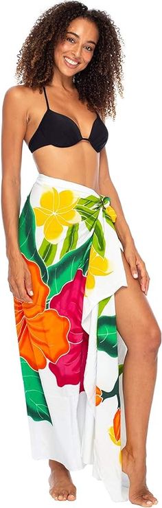 Island inspired floral Bali sarong swimsuit cover up, gives you style and comfort at the beach, poolside, lounging on a hot summer day or on your next tropical vacation. Unique, vibrant colors give it a spirited tropical feel. And the striking batik frangipani flower artisan print will make this sarong wrap a work of art. Includes a coconut shell clip for easy tying; just put an edge of the fabric in the two holes and pull through for a perfect fit. Length can be adjusted by simply folding the g Swimsuit Wrap Skirt, Sarong Swimsuit Cover, Sleeve Bathing Suit, Shell Clip, Flower Swimsuit, Beach Pareo, Pareo Sarong, Swimsuit Wrap, Sarong Wrap