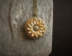 Detailed antique brass sunflower set on detailed antique brass filigree on an antique brass locket. Chain is antique brass. Locket opens with two spaces. Details: Locket measures 32mm in diameter Chain measures 24 inches Locket and chain are plated brass Lead and nickel free Thank you for shopping Delicate Industry :) Locket Chain, Gift Ideas For Mom, Brass Filigree, Unique Christmas Gift, Necklace Flower, Locket Necklace, Unique Christmas, Locket, Antique Brass