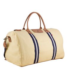 This duffle is a perfect size to bring as a carry-one or in addition to your other bags. There's a handy trolly slip on the back so it slips easily over your rollie-bag handles. With a full leather bottom and details, this bag will add some style back to your travels! Matching travel kits also available. (The Natural bag has black /natural striped webbing). This item can also be monogrammed!Product Overview: Dimensions: 18" x 10" x 10" with a 6" handle drop, 55" adjustable / detachable strap Hea Canvas Duffle Bag With Leather Trim, Everyday Double Handle Duffle Bag With Leather Trim, Canvas Duffle Bag With Leather Trim For On-the-go, Weekender Bag With Leather Trim For On-the-go, Luxury Leather-lined Duffle Bag With Double Handle, Beaded Bag, Travel Kits, Pocket Mirror, Bag Handle