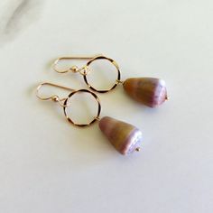 Hawaiian Cone Shell Earrings~ Pretty cone shells dangle from 14k gold fill textured hoops.  Hoops .5" SHOP~ https://www.etsy.com/shop/HanaMauiCreations?ref=si_shop International buyers please read our shipping policies before ordering~ POLICIES~ https://www.etsy.com/shop/HanaMauiCreations/policy?ref=shopinfo_policies_leftnav Shell Hoop Earrings, Earrings Pretty, Cone Shell, Island Fashion, Mermaid Earrings, Hawaii Beach, Hoop Earrings Gold, Shell Earrings, Gold Texture