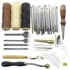 sewing supplies and tools laid out on a white surface