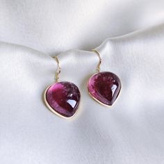 These stunning earrings are set in 14k Solid Yellow Gold with Natural Rubellite Pink Tourmaline. It is an unique gemstone earring pair for nearly every occasion and is completely hassle-free jewelry. 🔷 ABOUT GEMSTONE: Pink Tourmaline is a stunning gemstone, cherished for its soft pink hues that embody love, compassion, and emotional healing. Known as a stone of the heart, Pink Tourmaline is believed to promote feelings of joy, acceptance, and emotional balance, making it an excellent choice for Formal Teardrop Tourmaline Jewelry, Formal Teardrop Earrings With Bezel Setting, Fine Jewelry Yellow Gold Tourmaline Earrings, Yellow Gold Tourmaline Fine Jewelry Earrings, Elegant Pear-shaped Tourmaline Jewelry, Tourmaline Gemstone Earrings In Fine Jewelry Style, Fine Jewelry Tourmaline Gemstone Earrings, Luxury Tourmaline Yellow Gold Earrings, Pear-shaped Tourmaline Jewelry As A Gift