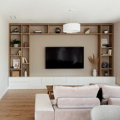 the living room is clean and ready to be used as a entertainment center or media room