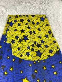 This blue and yellow African Fabric is high quality African print made from 100% cotton and it's 45 inches wide. It is used for making African Clothing, African quilts, & For Home decoration. FYI: Print is Double sided. The listing is for 1, 6 yards and Headwrap Each piece of fabric measures:  36in by 45in for 1 yard 216in by 45in for 6 yards 70in by 22in for Head wrap If you purchase more than one yard, you will receive one continuous piece. *If you require more than what I have listed, feel free to send me email. CARE INSTRUCTIONS: *DO NOT BLEACH *Hand wash with cold water and mild soap or Dry clean *Press with hot iron for a crispy look. Color may be different due to your monitor African Quilts, Clean And Press, African Prints, Ankara Fabric, African Fabric, Head Wrap, Blue And Yellow, African Clothing, Mild Soap