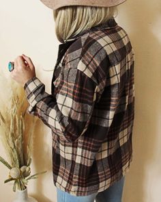 The softest sweet flannel for the season. Rich brown & rust tones pair with a button up front & cute pockets. Easy fit & perfect as is or layered. Color: Brown, cream & rust Soft poly & cotton blend Hand wash cold Small Medium Large Bust 42 44 46 Waist 42 44 46 Hips 43 45 47 Length 28 28 28 Bust, waist, and hip measurements are a total circumference. Length is measured from the top of the shirt to the hem. Measurements are an estimate. Large Bust, Flannel Shirt, Rust, Button Up, Cotton Blend, Hand Wash, Cream, Color