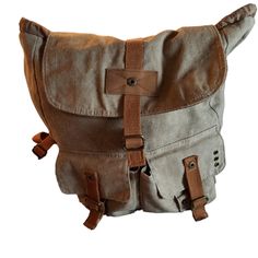 Urban Tan/Brown Backpack Mossimo Brand New Condition Brown Satchel Canvas Bag For Outdoor, Khaki Travel Satchel Backpack, Khaki Backpack Satchel For Travel, Beige Satchel Backpack With Leather Handles, Khaki Backpack With Adjustable Strap, Brown Casual Outdoor Satchel, Casual Brown Satchel For Outdoor, Casual Beige Satchel For Outdoor, Khaki Rectangular Backpack With Adjustable Strap