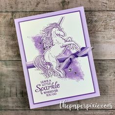 a purple card with a unicorn on it