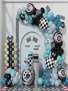 a car themed birthday party with balloons and decorations