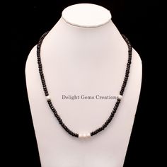 Product Details :  ITEM : BLACK SPINEL AND PEARL BEADED NECKLACE Item Code : DGC2513 Gemstone Name :  BLACK SPINEL, PEARL Chain Style : BEADED Beads Shape : FACETED RONDELLE Beads Size : 5-6/7 mm Approx. Length : 20 INCH WITH LOBSTER CLASP Weight : 170 Cts. Approx. Customization : **Available** Please Feel Free To Contact If You Have Any Query. Black Single Strand Pearl Necklace As Gift, Black Pearl Necklace With Round Beads As Gift, Black Pearl Necklace For A Gift, Black Rondelle Beaded Necklaces, Black Beaded Rondelle Jewelry, Black Single Strand Beads For Jewelry Making, Black Rondelle Gemstone Bead Necklace, Black Rondelle Jewelry As A Gift, Black Beaded Rondelle Necklace