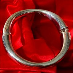 We Have Many Sterling Bracelets That Are .925 The Britannica Bracelets Are 0.9584 Purity However The Bracelet We We Are Offering Is Composed Of .999 Silver. This Is The Highest Possible Silver Content From Which Any Item Of Silver Jewelry Could Be Crafted. We Only Have The One Available And This Item Is Actually For The True Collector For The Connoisseur Who Appreciates The Best Sterling Available Anywhere. 40.84 Grams Silver Bangle With Sterling Silver Clasp, Sterling Silver Bangle With Shiny Finish For Anniversary, Silver Hinged Bangle As Gift, Formal Metal Bangle With Polished Finish, Silver Hinged Bangle For Anniversary, Formal Polished Metal Bangle, Anniversary Silver Hinged Bangle, Hallmarked Sterling Silver Bangle For Formal Occasions, Silver Polished Round Bangle