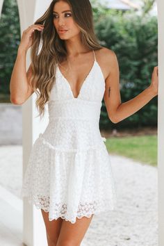 Shop the Belize Flounce Hem Mini Dress White | Selfie Leslie Summer Lace Mini Dress With Straps, White Strappy Back Dress With Crisscross Straps, White Dresses With Crisscross Straps And Strappy Back, White Dress With Crisscross Straps And Strappy Back, White Flirty Mini Dress With Strappy Back, Flirty White Mini Dress With Strappy Back, Feminine Summer Dresses With Lace Back, Backless Mini Dress With Delicate Straps For Brunch, Spring Mini Dress With Lace Back And Spaghetti Straps