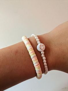 This is a cute summer bracelet that can go with almost any outfit!! It is made with clay beads, white pearl beads and a cute smiley face bead that just completes the bracelet set! Casual Round Beaded Pearl Bracelet For Summer, Casual Round Beads Pearl Bracelet For Summer, Casual Pearl Bracelet With Round Beads For Summer, Casual Summer Pearl Bracelet With Round Beads, Trendy White Beaded Pearl Bracelet, Playful White Round Beaded Bracelets, Playful White Beaded Bracelets, Casual White Friendship Bracelets With Letter Beads, Playful White Round Bead Bracelets