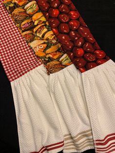 three different types of cloths with apples and hamburgers on them, one is red and the other white