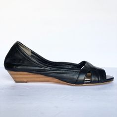 These Cole Haan Women's Black Leather Nikeair Peep Toe Wedges Are New Without Box And Never Worn. Size: 6.5 Description: - Peep Toe - Crisscross Detail - Stacked Wedge Heel - Slip-On Measurements: Sole Length: 9.25" Foot Bed Width: 3.1" Heel Height: 1.25" Wshl - 54 Black Leather Sole Heels For Spring, Spring Black Heels With Leather Sole, Casual Open Toe Fitted Heels, Casual Fitted Open Toe Heels, Spring Leather Wedge Sandals With Almond Toe, Black Leather Low Heel Wedge Sandals, Casual Sandals With Snug Fit And Round Toe, Black Sandals With Leather Footbed And Low Heel, Black Low Heel Sandals With Leather Footbed