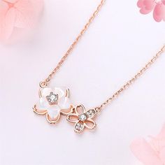 Description:Natural Duo Cherry Blossom Necklace Specifications:Size: 40 cm * 5 cmWeight: 2.1 g/pcMaterial: Copper, Cubic Zirconia, Natural Pearl Shell, 24k goldColors: Gold Bloom into style with our Natural Duo Cherry Blossom Necklace! This playful piece features a charming duo of cherry blossom pendants, adding a touch of nature to any outfit. Made with natural materials, this necklace is a unique and quirky addition to your collection. 🌸 Sakura Necklace, Cherry Blossom Necklace, Daily Jewelry, Jewelry Lookbook, Natural Pearl, Pearl Shell, Exquisite Jewelry, Cherry Blossoms, Natural Pearls