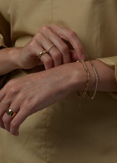 The TWO / ONE Collection features contrasting materials for texture and balance.Featuring baguette diamonds set in 14k yellow gold.Complete the look with our Familia Cuban Bracelet. Links are semi hollow for a light and comfortable fit.Lobster clasp closure, with extension. 14k solid gold—always Weight: 7g Total width: 2.7mm Length: 6.5-7", Adjustable Height: 2.5mm Diamond size: 1.5x2.4mm Carat weight per diamond: ctw Total carat weight: Approx 0.75ctw Diamond shape: Baguette Diamond clarity: VS Timeless Diamond Bracelet, Tarnish Resistant, Elegant Gold Bracelet With Diamond Accents For Everyday, Elegant Everyday Tennis Bracelet Tarnish Resistant, Everyday 14k Gold Tennis Bracelet, Timeless Tarnish-resistant Diamond Bracelet, Fine Jewelry Diamond Gold Bracelet For Everyday, Timeless Gold Bracelet With Diamond Accents For Everyday Wear, Everyday Timeless Gold Bracelet With Diamond Accents, Everyday Luxury Fine Jewelry Chain Bracelet With Diamond Accents