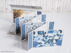 four cards with blue and white flowers on them