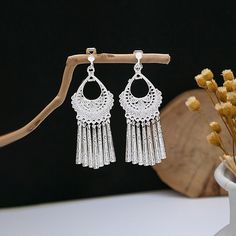 Material: Alloy Fashion Element: Circle, Triangle, Ellipse Style: Ethnic Style Silver Fringe Chandelier Drop Earrings, Silver Fringe Metal Earrings, Silver Dangle Tassel Earrings, Silver Fringe Bohemian Earrings, Silver Bohemian Tassel Earrings With Fringe, Bohemian Silver Fringe Earrings, Silver Fringe Drop Earrings, Silver Bohemian Fringe Earrings, Silver Metal Chandelier Earrings With Tassels