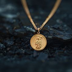 Our Gold Santa Muerte Pendant, crafted in the USA from real solid gold, embodies devotion and protection. This timeless piece showcases exquisite craftsmanship, designed to last a lifetime. Perfect for those seeking a unique and meaningful symbol, this pendant is a testament to enduring quality and elegance. PENDANT INFORMATIONThis pendant is made of real, solid gold.• Made in USA• Material: 14k or 18k solid gold• Finish: polished• Height: 1.13" (29 mm) x Width: 1" (26 mm)• Pendant weight: appro April Crafts, Solid Gold Chains, Mini Pendants, Patron Saints, Yellow Gold Pendants, Elegant Jewelry, Gold Finish, Gold Pendant, Timeless Pieces