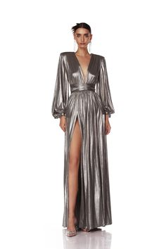 Buy the Beautiful Gorgias Zoe Silver Gown for any kind of party, wedding, and occasion from Bronx and banco. Similar products are available. V-neck Evening Dress With Side Slits For Party, Glamorous V-neck Evening Dress With Back Opening, Luxury V-neck Maxi Dress For Gala, Luxury V-neck Evening Dress For Night Out, Glamorous V-neck Gown With Back Opening, V-neck Evening Dress With Back Opening, Glamorous Formal Gown With Draped Sleeves, Party Dresses With Long Sleeves And Structured Shoulders, Long Sleeve Dresses With Structured Shoulders For Party