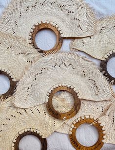 several pieces of woven material with holes cut out in the middle to make them look like they are made from wood