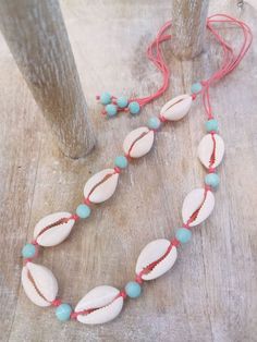 Boho chic Cowrie Shell necklaces. These are made in house so we can get a little creative with the designs, adding semi-precious stones or coral beads to coordinate with our gorgeous cord colors, which makes these Corwie Shell necklaces quite unique and stylish. There is also a matching bracelet should you want to complete the look, or just biy the bracelet by itself. If you do not see a cord color you like, send us a message, we will make it for you! The necklace is adjustable from choker size Handmade Coral Beaded Necklaces Spiritual Style, Handmade Artisan Coral Beaded Necklaces, Handmade Coral Beaded Necklaces For Spiritual Use, Handmade Spiritual Coral Beaded Necklaces, Artisan Coral Beaded Necklace Handmade, Spiritual Beaded Adjustable Necklaces For Beachwear, Artisan Handmade Coral Beaded Necklace, Spiritual Adjustable Beaded Necklaces For Beach, Bohemian Coral Jewelry For The Beach