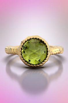 18k yellow gold ring made in Italy, 14k solid gold ring with a round Peridot. Rose cut Peridot ring in real gold, Italian fine jewelry This sophisticated ring features a round rose cut Peridot 2.1 carats set in a yellow gold ring made in 14k (585) or 18k(750) with unique natural embossed texture . This ring is a great choice for your engagement proposal or for renewing your Wedding Vows, a unique design for a unique moment. ❥Details Gemstone: Peridot Shape: round rose cut Measurements: approx. 8 Push Present, August Birthstone Ring, Peridot Birthstone, Engagement Proposal, Thoughtful Gifts For Her, August Birthstone, Proposal Engagement, Peridot Ring, 18k Yellow Gold Ring