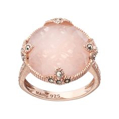 Adorned with a round-cut genuine rose quartz center stone and marcasite stone accents, this 18k rose gold over sterling silver ring abounds with breathtaking beauty.RING DETAILSWidth: .67 in. Metal: sterling silverPlating: 18k rose goldSTONE DETAILSStone type: rose quartzCenter stone weight: 7 1/3 ct.Center stone size: 17 mm Shape: roundSetting: bezelGemstones may have been treated to enhance their appearance. Special care may be required. Size: 7. Color: Multi/None. Gender: unisex. Age Group: a Pink Gold Rings, Marcasite Jewelry, Rose Gold Quartz, Rose Quartz Ring, Circle Ring, Rose Gold Jewelry, Quartz Ring, Lovely Jewellery, Silver Roses