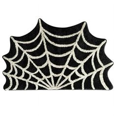 a black and white spider web rug