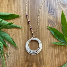 This elegant necklace offers up a unique combination of playfulness & timeless style. Seven organically shaped & uniquely textured sterling silver circles layer gracefully on a beautiful 14K gold filled double cable chain. Each ring is handcrafted individually to represent your journey through the decades. Circles are hammered flat & strong, and given a rustic sparkly texture.  The circles shimmer & move gracefully with you, capturing the light & landing in various arrays. This piece is a beautiful way to celebrate a milestone birthday, and the quality construction ensures it will be treasured for years to come. ✦ Pendant, clasp & extender are all bright sterling silver. The chain is 14K gold fill. ✦ Each circle is individually made by hand & and connected together with a soldered (sealed) Sixtieth Birthday, Elegant Gift Wrapping, Birthday Necklace, Layered Rings, Birthday Ring, Gift For Woman, Elegant Necklace, 7 Rings, Handcrafted Necklace