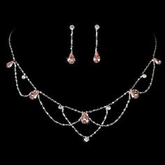 Pink Teardrop Crystal Wedding Jewelry Set Add vintage elegance to your wedding day or special occasion with this beautiful silver plated necklace and earring set. Clear round and pink crystal rhinestones glisten in a charming vintage inspired design. This jewelry set would be perfect for the bride or her bridesmaids as well as for prom. Size: The necklace is 15 1/2" long with a 3 1/2" extender. The pierced earrings are 1 1/4" long. Color: Silver/Pink. Style: ne8000p. Do you need several jewelry Prom Jewelry Sets, Pink Jewelry Set, Earring Bridal, Prom Necklaces, Crystal Wedding Jewelry, Formal Jewelry, Princess Jewelry, Bridal Jewelry Set, Diamond Necklace Set