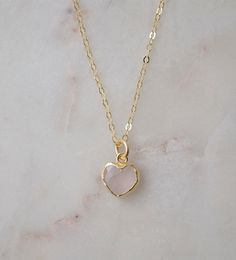 Looking for a unique accessory for some self love, or love for that special someone? Crafted from 14k gold filled and natural Rose Quartz, this pendant is the perfect, sparkling way to show anyone how much you care. Rose Quartz is a stone of love. It is believed to restore trust & harmony in relationships and encourage unconditional love. It purifies the heart and promotes self love, inner healing, and friendship. It is an alternate birthstone for January, as well as the spiritual birthstone for Dainty Birthstone Jewelry For Valentine's Day, Minimalist Gemstone Jewelry For Valentine's Day, Dainty Heart Birthstone Necklace For Valentine's Day, Valentine's Day Dainty Heart Birthstone Necklace, Tiny Heart Pendant Jewelry For Valentine's Day, Gold Rose Quartz Pendant Jewelry, Delicate 14k Gold Filled Jewelry Gift For Mom, Delicate 14k Gold Filled Jewelry For Mom, Dainty Rose Gold Jewelry With Heart Charm