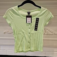 Keep Your Kid Stylish With A Lightweight, Button T-Shirt. Wear It Alone, Over Or Under A Dress Or Even Unbuttoned As A Cardigan/Cover-Up! Target Brand - Art Class Size: Large 10/12 Color: Bright Lime/Neon Green Please Zoom In And Out Of Pictures-Ask Any Questions. Thank You. Trendy Spring T-shirt With Buttons, Trendy Spring T-shirt With Button Closure, Summer T-shirt With Button Closure, Fitted Spring T-shirt With Button Closure, Trendy Summer T-shirt With Button Closure, Green Summer T-shirt With Buttons, Spring Short Sleeve T-shirt With Buttons, Spring Cotton T-shirt With Button Closure, Spring Short Sleeve Button T-shirt