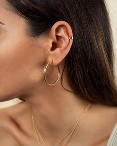 "A timeless addition to your jewelry collection, these simple tube hoops will never go out of style, no matter the season. Light as a feather and super comfortable so you can wear them all day. * D E T A I L S * ∙ Sold as a PAIR ∙ Material: .925 Sterling Silver or 18K Gold Plated over .925 Sterling Silver ∙ Dimensions: Inner diameter: 30mm - Outer diameter: 35mm // Thickness: 3mm ∙ Hypoallergenic & nickel-free * P A C K A G I N G * ∙ All jewelry is sent out beautifully packaged in our signat Classic Hoop Earrings With Simple Design, Classic Hoop Jewelry With Simple Design, Classic Simple Hoop Earrings, Minimalist Hoop Huggie Earrings, Everyday Hoop Cartilage Earrings, Minimalist Diamond Hoop Earrings, Tarnish Resistant Sterling Silver Hoop Earrings, Minimalist Hypoallergenic Hoop Jewelry, Minimalist Hoop Earrings For Pierced Ears