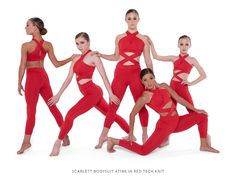 a group of women in red dance outfits